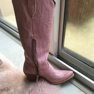 Pink leather boots worm three times